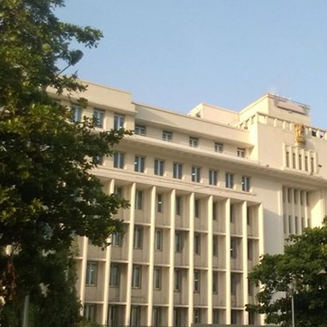 Government building entrance protected by door frame metal detector screening